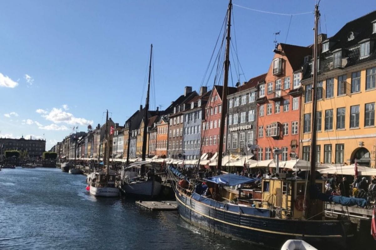 “Colorful houses along Nyhavn Canal, Copenhagen — waterfront dining, vibrant streets, and curated Danish experiences, TripsWithSam Denmark itinerary.”