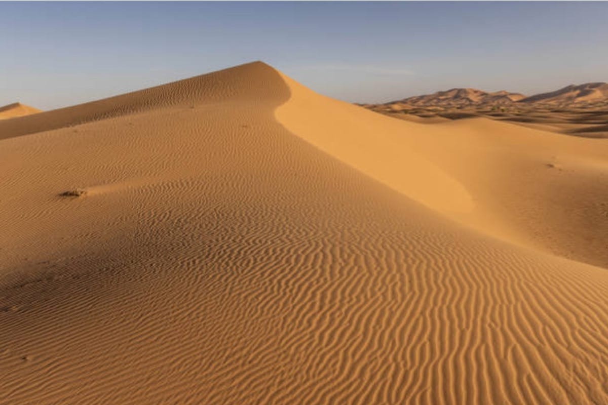 “Golden sand dunes of the Sahara Desert, Morocco — expansive landscapes, luxury desert adventures, and curated Moroccan journeys, TripsWithSam Morocco itinerary.”