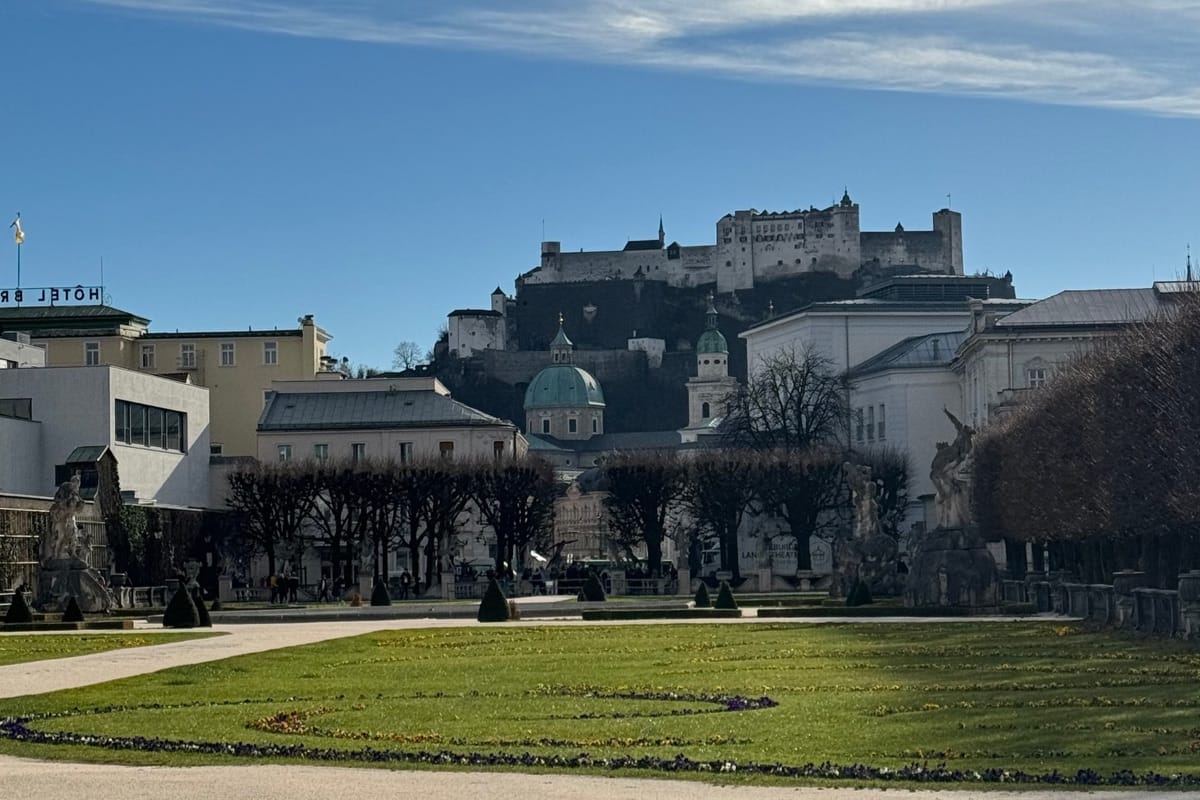“Salzburg Fortress (Hohensalzburg Castle) overlooking the historic city — baroque architecture, alpine backdrop, and refined Austrian charm, TripsWithSam Austria itinerary.”