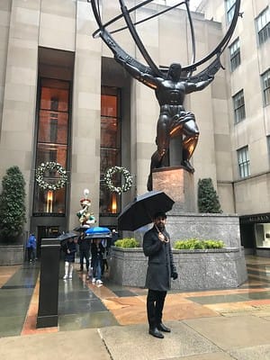 Simran Pal posing with the Hercules statue at Rockefeller Center,New York
