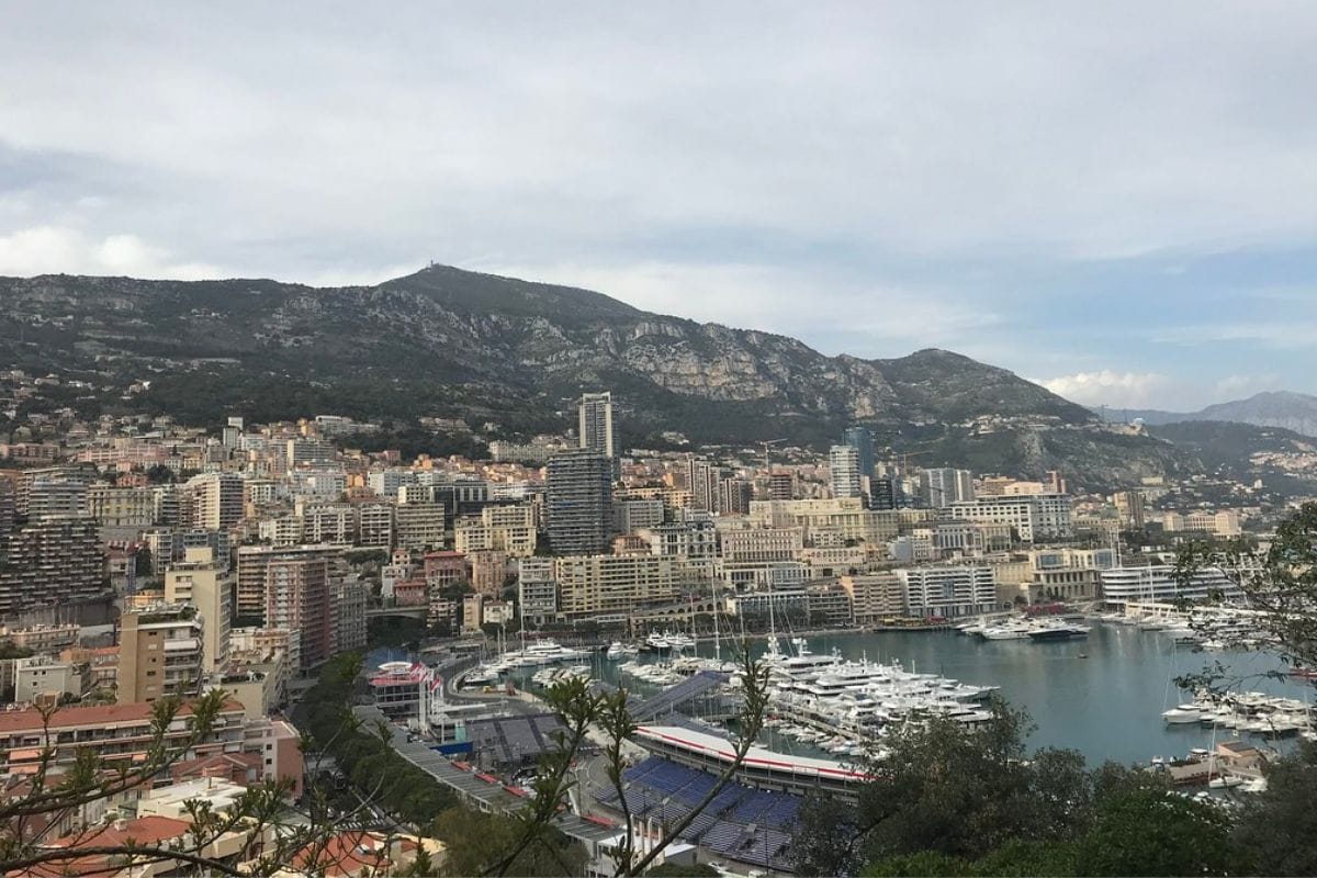 “Panoramic view of Monaco’s elegant buildings, manicured gardens, and surrounding mountains — luxury Mediterranean lifestyle and scenic charm, TripsWithSam Monaco itinerary.”
