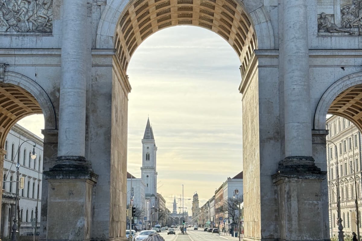 “Historic gate in Munich surrounded by city streets — Bavarian architecture, cultural charm, and luxury travel experiences, TripsWithSam Germany itinerary.”