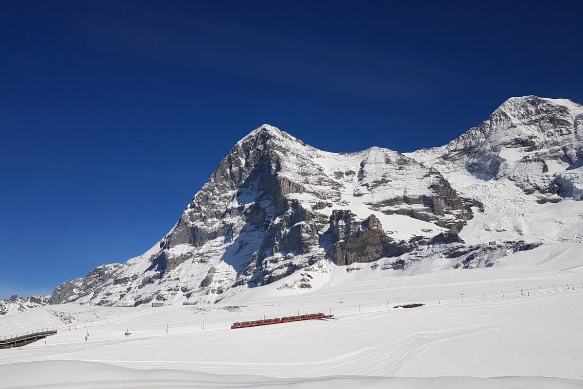 Swiss Alps mountaine with scenic train travelling towards Jungfraujoch - Luxury travel Itineraries by Trips With Sam