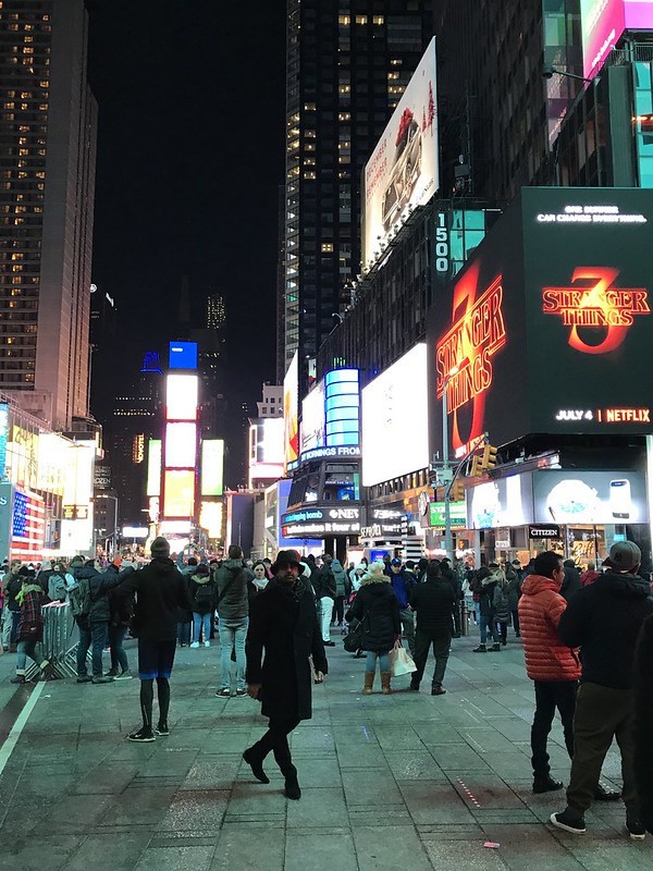 Sam Bhandari in Times Square at night in New York City, USA